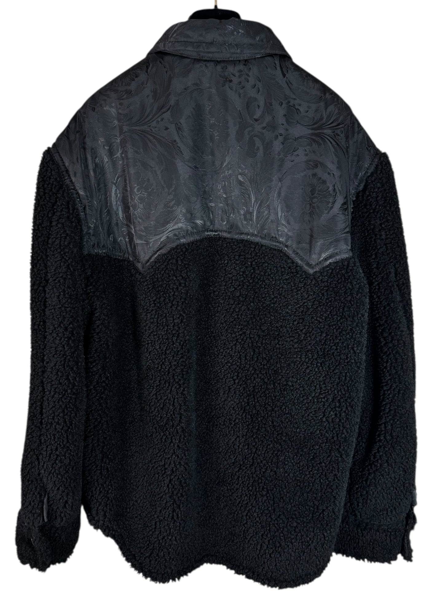 Giacca Versace nera in eco shearling con inserti jacquard