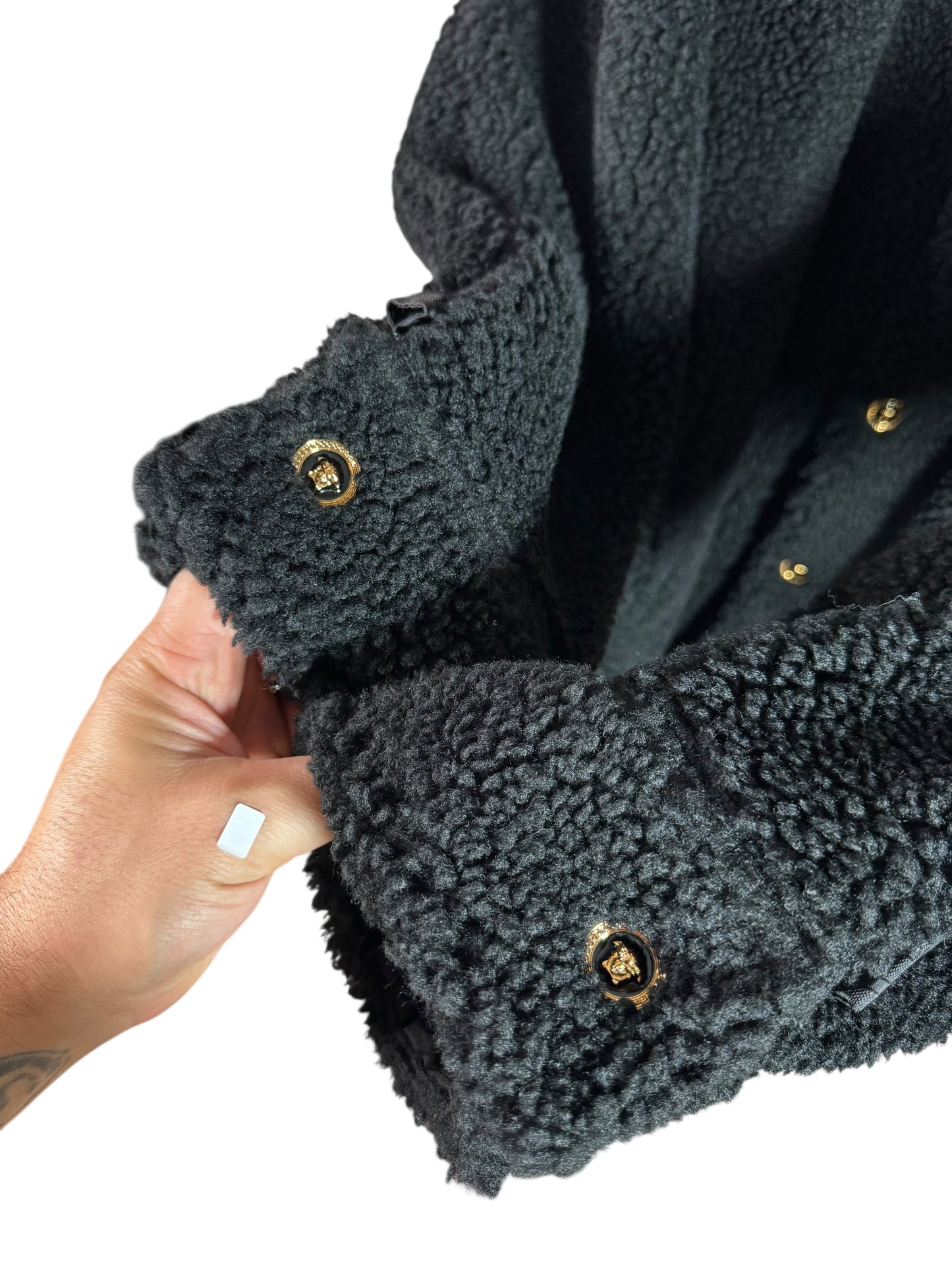 Giacca Versace nera in eco shearling con inserti jacquard