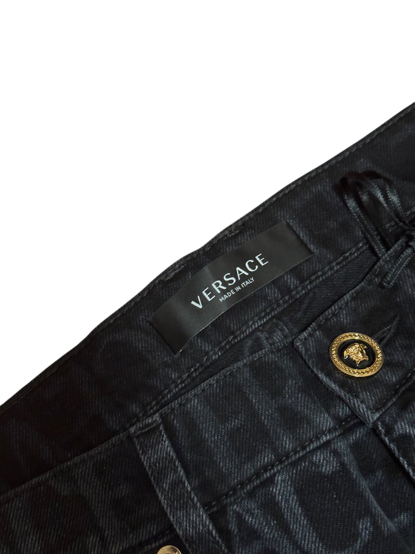 Versace – Jeans in Denim con Monogram All-Over