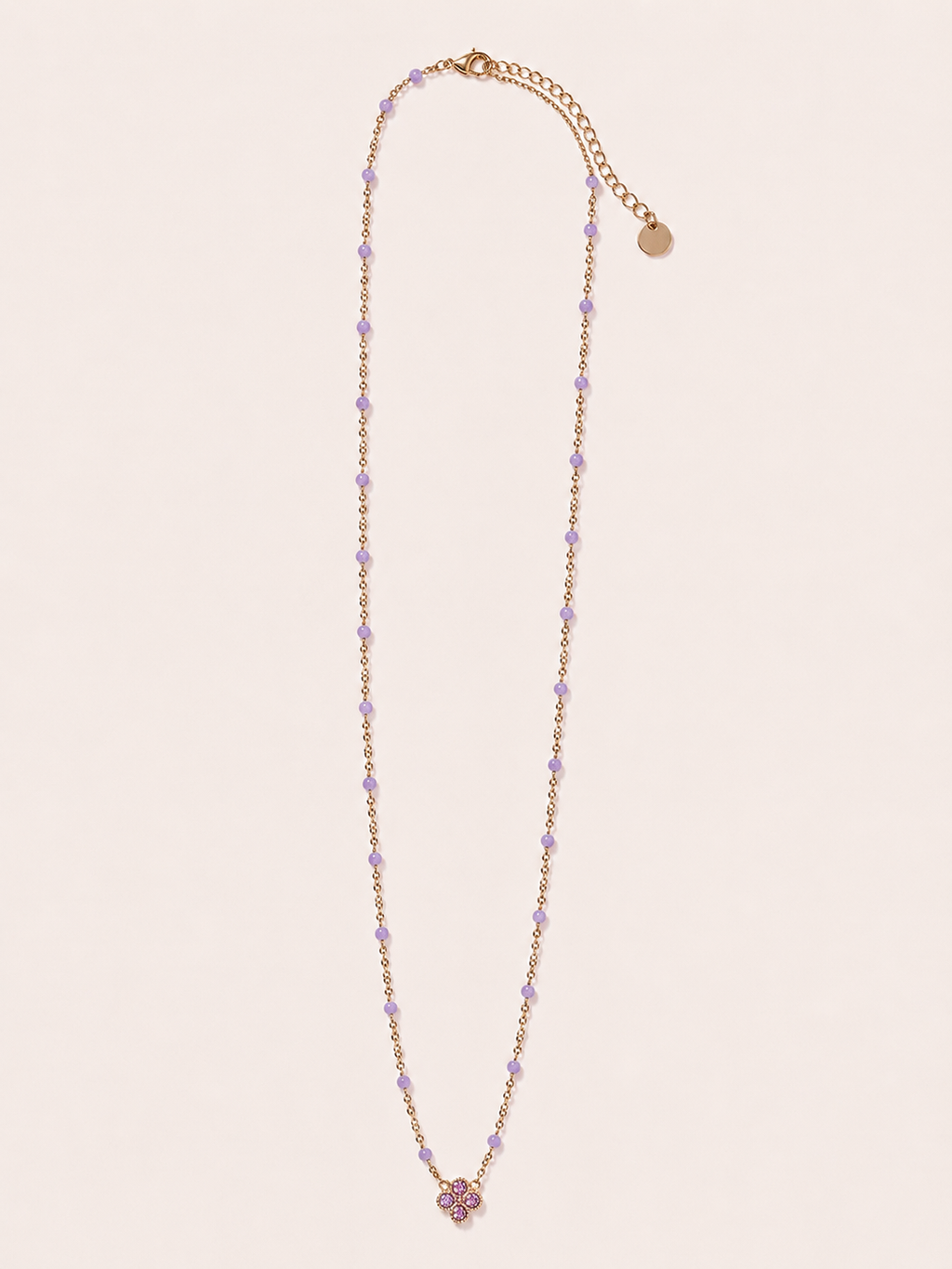 Collana dorata con fiore e cristalli lilla