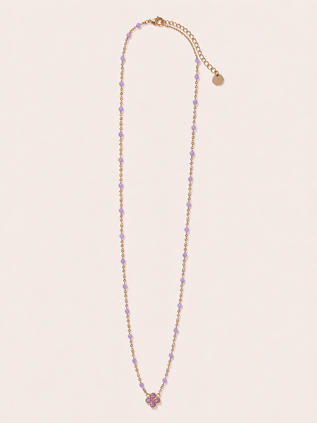 Collana dorata con fiore e cristalli lilla