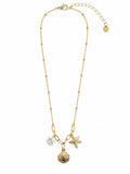 Collana dorata con conchiglia, stella marina e punto luce