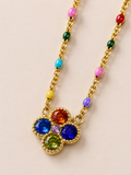 Collana dorata con fiore e cristalli multicolor