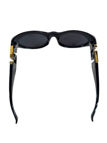 Occhiali da sole vintage Gianni Versace anni ’90 nero con logo Greca dorato